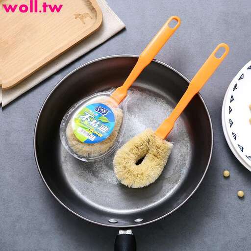 a pan with a cup of food and a spoon