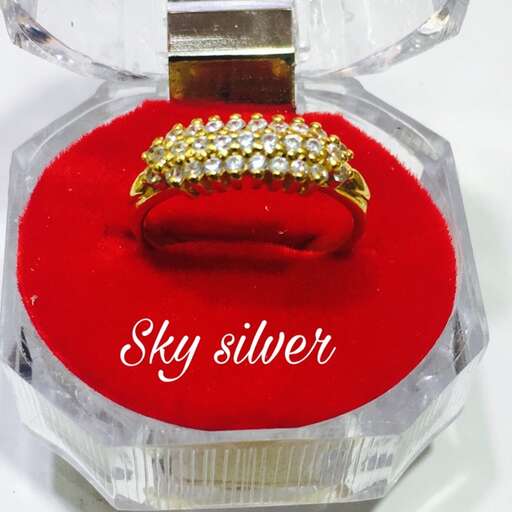 a diamond ring in a glass jar