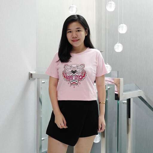 pink shirt in black shorts