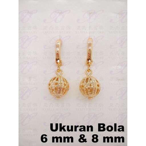 a pair of gold earrings