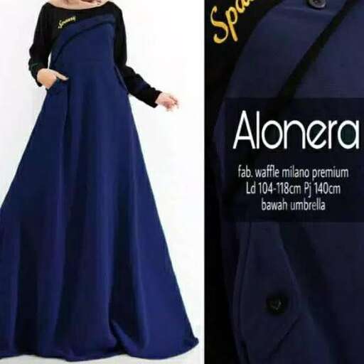 a long blue dress with a black long sleeved top.