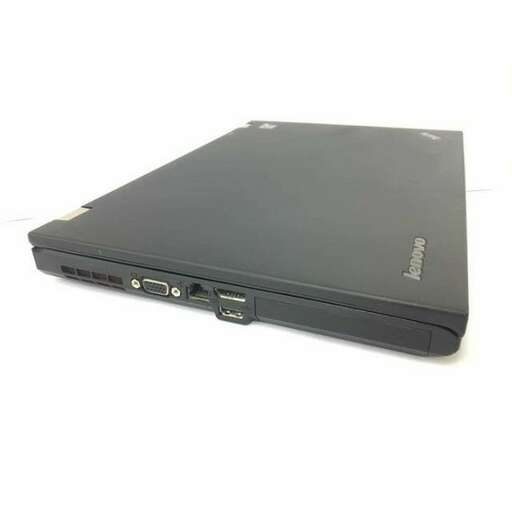 a laptop computer sitting on top of a white surface.