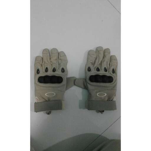 two large gloves hanging on the wall.