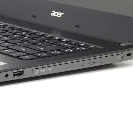 a laptop computer sitting on a white surface.