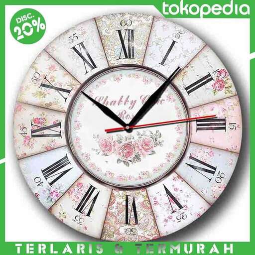 a clock with a floral design on the face of it.