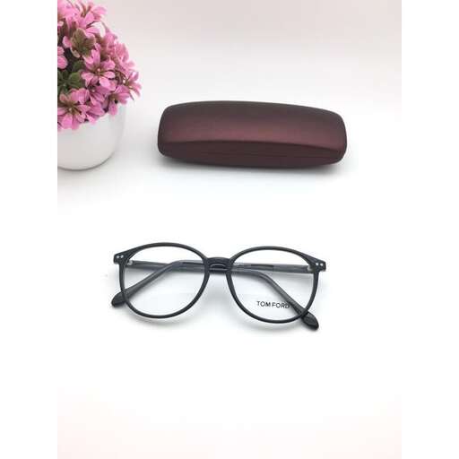 a pair of black glasses and a pink flower