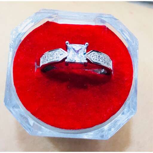 custom diamond engagement ring in a red box