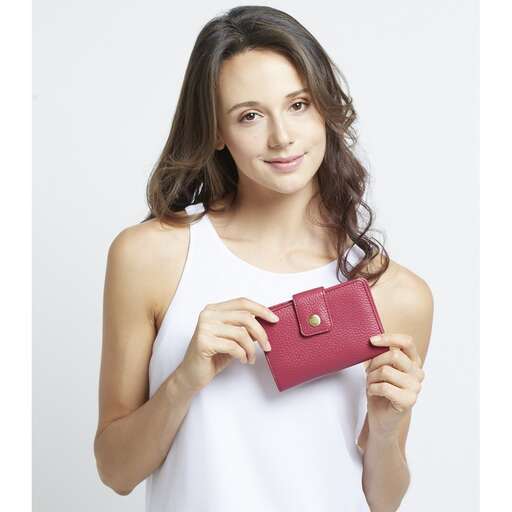 girl in white dress holding red wallet