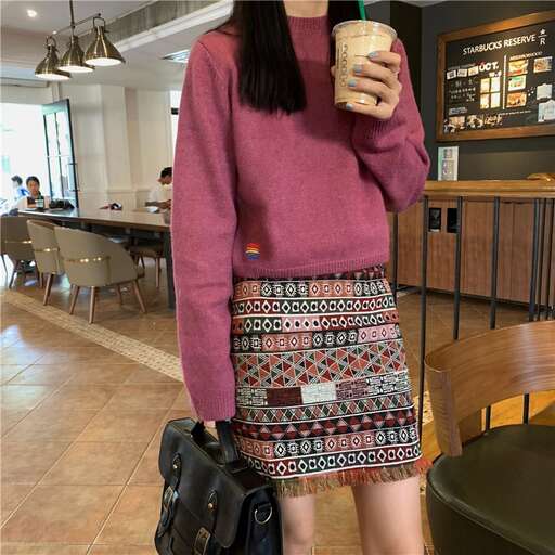 a woman in a skirt and a black backpack