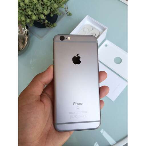 a person holding a smart phone in their hand.