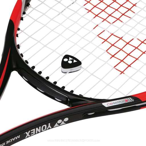 a close up of a tennis racket with a face on it.