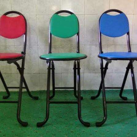 a set of three chairs in a row