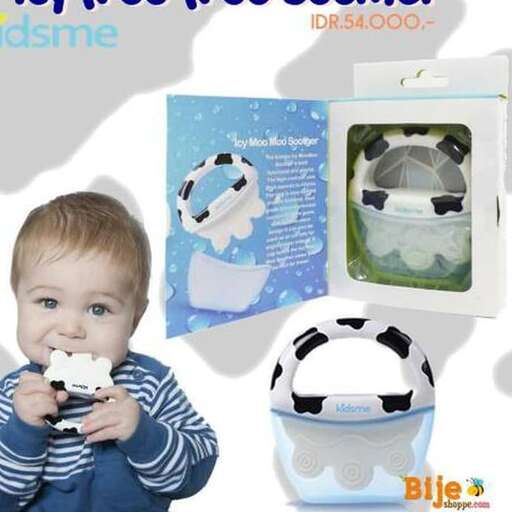 a baby in a blue and white shirt is holding a toy.