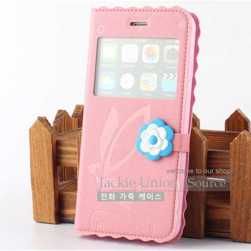 a pink cell phone case with a flower on the front.