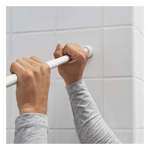 a person holding a toothbrush in their hand.