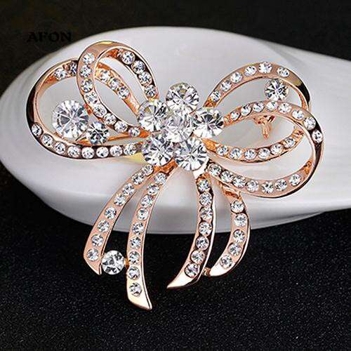 a beautiful diamond brooch in a beautiful gold setting.