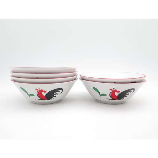 a pair of bowls with a bird on the rim.