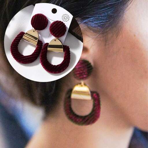 red and green earrings with a wooden bead in the middle