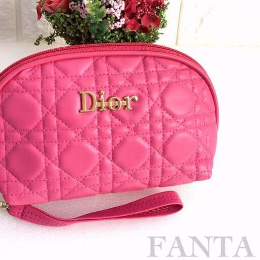 pink purse with a flower in it.