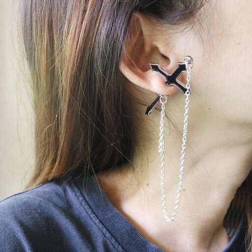 a woman with a chain in her ear