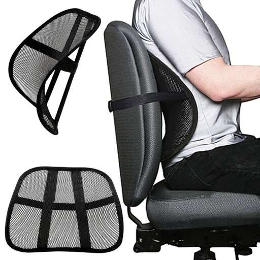 a man sitting in a chair with a lamp on it.