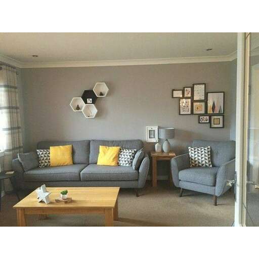 a living room with gray couches and a coffee table.