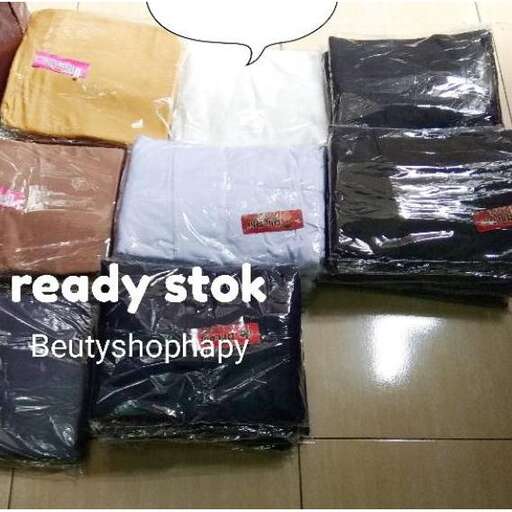 a pile of clothes in plastic bags.