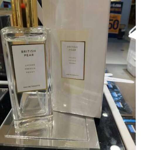 a bottle of perfume on a stand