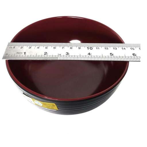 a measuring cup with a ruler
