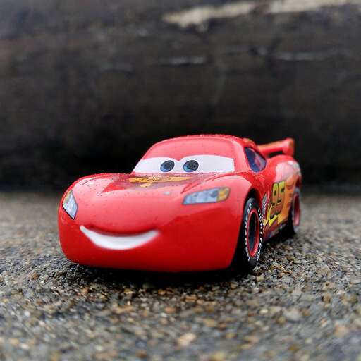 a toy car on the beach