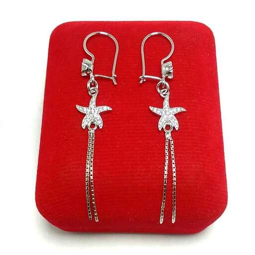 earrings in sterling silver with a white stone cross