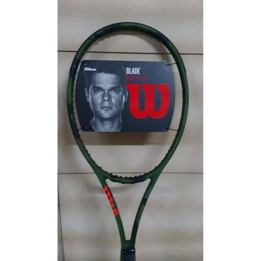 a tennis racket with a picture of a tennis player on it.