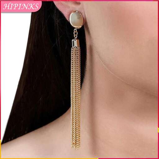 a pair of earrings with a pearl and diamond.
