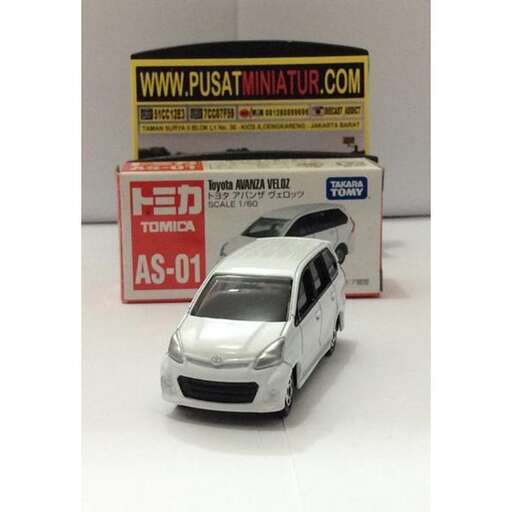 a car is shown with a sign in the background.