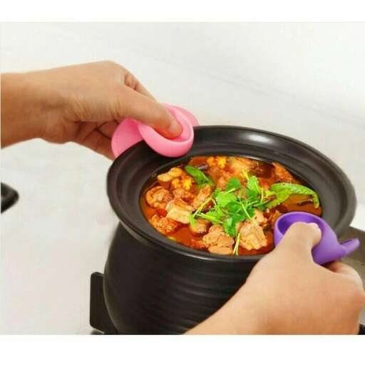 a person is using a pot of soup to cook.