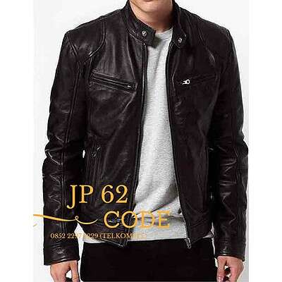 a man in a black leather jacket and black pants.