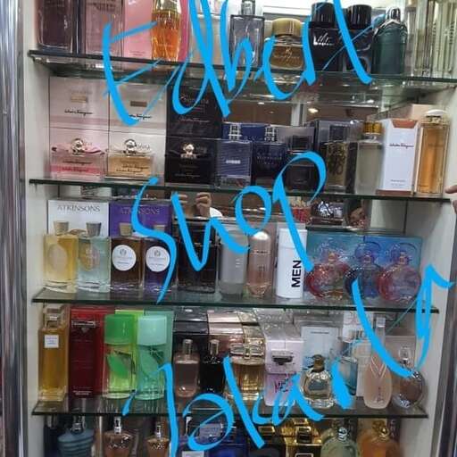 a window display with a lot of perfumes.