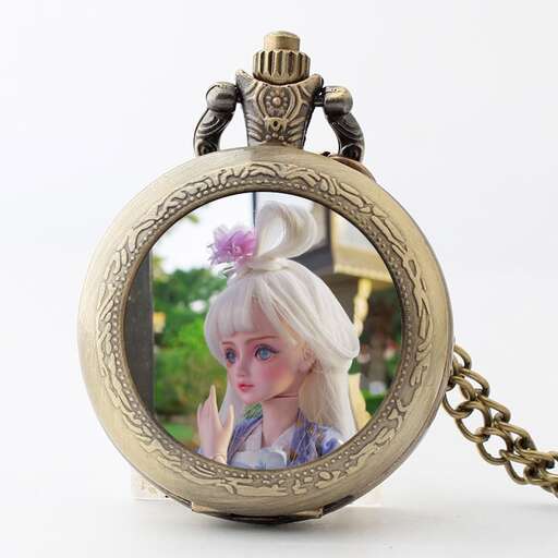 a small pocket watch with a flower in it