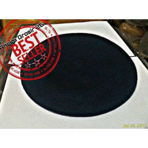 a black and white circle with a red logo.