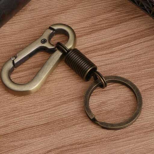 a metal ring with a handle on a table.