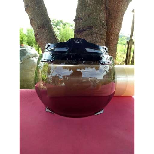 a large bowl of liquid sitting on a table.