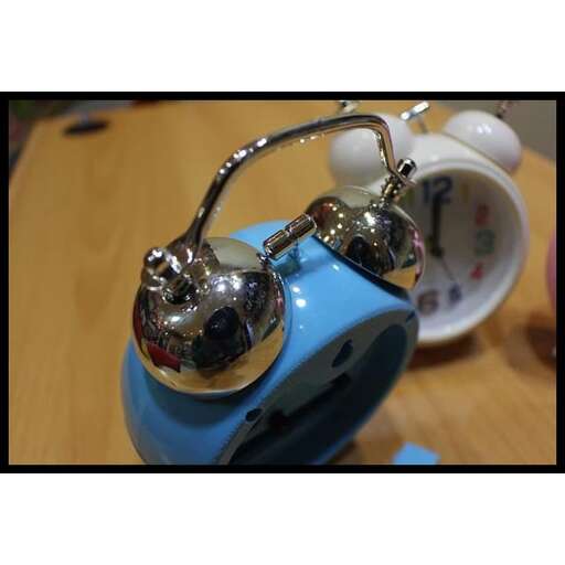 a teapot and a cup on a table.