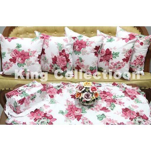 a set of pillows with pink roses on a white background