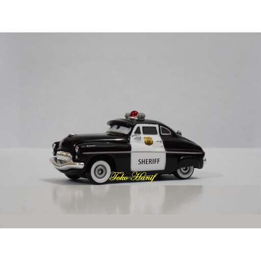 police car - - a toy car that was designed by person.