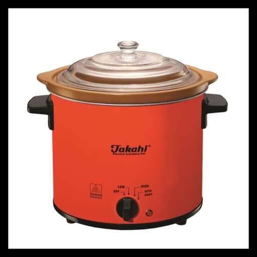 a red pot with a lid on top of it.