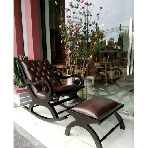 a chair that is sitting outside of a store.