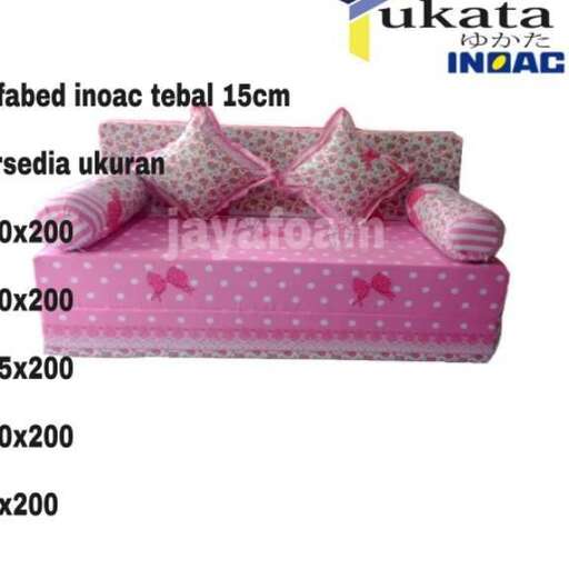 a mattress with a pink cover