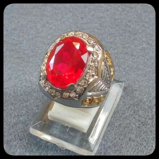a ring with a red stone