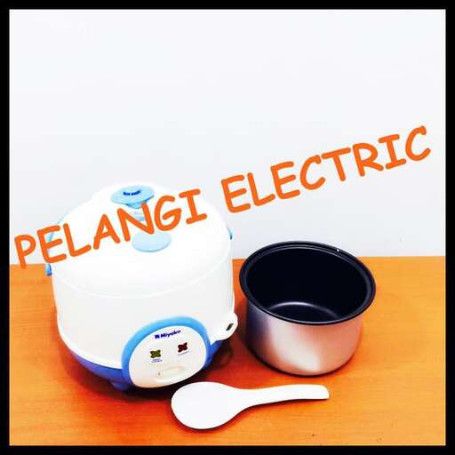 a small electric toothbrush and a cup of tea.
