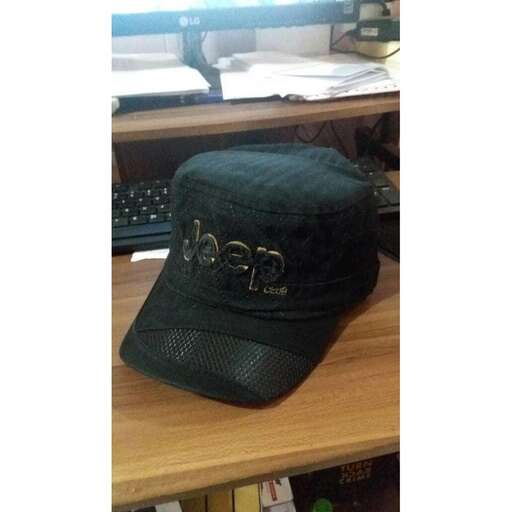 a hat sitting on top of a wooden desk.
